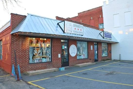 Outside view of Sparky's Toys & Gifts storefront on Haywood Road in Asheville, NC